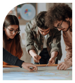 Team collaborating around laptop